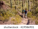 Two desert hikers in the American Southwest