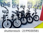 Small photo of GREATER NOIDA, INDIA - SEPTEMBER 7, 2022: Electric bicycles are on display at Moto Mobility stall at EV India 2022 electric motor vehicle show at India Expo Center, Greater Noida in India.