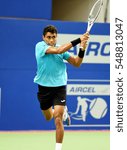 Small photo of CHENNAI, INDIA - JANUARY 2, 2017: Thiago Monteiro of Brazil plays against Daniil Medvedev of Russia in the first round match at Aircel Chennai Open tournament at SDAT Tennis Stadium in Chennai.