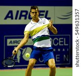 Small photo of CHENNAI, INDIA - JANUARY 3, 2017: Guillermo Garcia-Lopez of Spain plays against Aljaz Bedene of Great Britain in first round match at Aircel Chennai Open tournament at SDAT Tennis Stadium in Chennai.