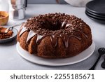 Chocolate bundt cake drizzled with chocolate ganache glaze