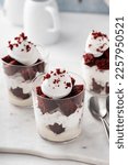 Small photo of Red velvet trifle or parfait with cream cheese mousse and whipped cream, dessert in a glass idea