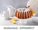 Lemon bundt cake with sugar powder vanilla icing on a cake stand