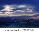 Cargo Ship and Lightning over sea with dark clouds