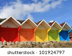 Row Of Colorful Beach Huts With ...