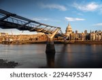 The Y shaped Millennium Bridge and St Paul's Cathedral across River Thames in UK