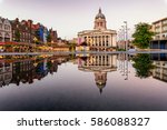 Clear reflection of a council house and market in the fountain  in Nottingham city, England.