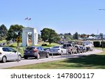Small photo of VANCOUVER, BC - JULY 28: The peace arch border on July 28, 2013 in Vancouver, BC, Canada. Peace arch border between Canada and USA represent the world's longest undefended border.