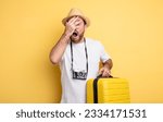 Small photo of middle age man tourist looking shocked, scared or terrified, covering face with hand. travel concept
