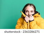 Small photo of young pretty woman wearing an anorak