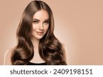 Small photo of Beauty girl with long and shiny wavy hair . Beautiful woman model with curly hairstyle .
