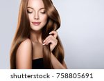 Beautiful model girl with shiny brown and straight long  hair . Keratin  straightening . Treatment, care and spa procedures. Smooth hairstyle