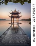 Small photo of illuminated ancient Jixian Pavilion at West Lake, Hangzhou, China. All Chinese words only introduce itself which means Jixian Pavilion without advertisement.