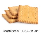 Pile of four rectangular butter biscuits isolated on white.