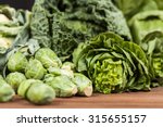 Assortment of green vegetables on wooden surface