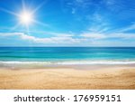 seascape and sun on blue sky background
