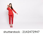 Young Asian female holding red heart isolated on white background