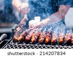 Pork on skewers cooked on barbecue grill.