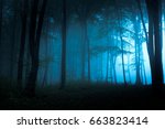 Spooky blue foggy forest