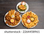 Small photo of Set of appetizers Combo , Nachos, and Baked potato with cheese top view