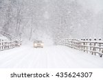 Car driving on a heavy winter road