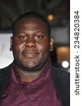 Small photo of LOS ANGELES, CA - NOVEMBER 3, 2014: Atkins Estimond at the premiere of his movie "Dumb and Dumber To" at the Regency Village Theatre, Westwood.