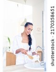 woman washing dishes with... | Shutterstock . vector #2170358651