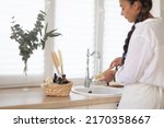 woman washing dishes with... | Shutterstock . vector #2170358667