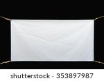 Copy space for text on disastrously white vinyl banner on black background .Clipping path
