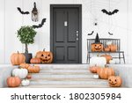 Carved pumpkins, bats and spiders on stairs and bench near modern house with black front door, tree in pot and white walls. Concept of halloween. 3d rendering