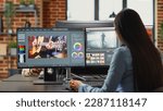 Small photo of Graphic designer creating professional movie content with filmmaking software in agency office, creative digital film. Cinematographer editing video footage with lighting and focus, videography.