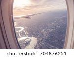  Aerial view of Central London through airplane window vintage colour