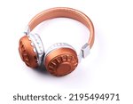 Stereo headphones brown bronze color isolated on white background closeup