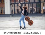 A Female Musician With A Cello...