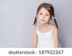 Small photo of Portrait of disaffected preschooler girl at home