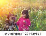 Happy Little Girl With Dog In...