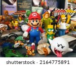 Small photo of Ankara, Turkey-February 3, 2019: Super Mario Bros, Simpsons, Scrat, Snoopy, He-Man and other cartoon toyz on a shelf.