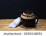 Brown Ceramic Teapot On A...
