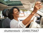 Portrait smiling woman driving car