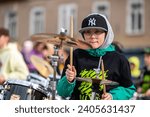 Small photo of Dobele, Latvia - May 13, 2022: Summit of small drummers in the historical time of Dobele market, Dozens of drummers play various compositions synchronously