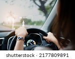 Woman driver driving the modern EV car - electric vehicle on the road and activate auto driving assist and navigation. Land vehicle technology  concept.