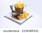 french fries with ketchup. Fast food. Appetizing food on a white background. Menu in the restaurant. Home food delivery. Junk food. Plate with a dish. golden potato