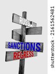 Small photo of Wooden road sign with words war, russia, insane, sanctions, aggression, regress