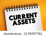 Small photo of Current assets - assets of a company that are expected to be sold or used as a result of business operations over the next year, text concept on notepad