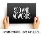 Seo and Adwords text on card, business concept background