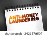 Small photo of Anti Money Laundering - set of regulations, laws, and procedures designed to prevent criminals from disguising illegally obtained funds as legitimate income, text concept on notepad
