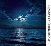 Moon Light Over Darken Water In ...