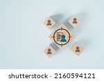 Small photo of person and data sheet in focus icon on wooden cube block for buyer persona and target customer concept, buyer or customer psychology profile or characteristics