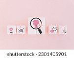 pink lady inside magnifying glass icon on wooden cube blocks with others business icon for buyer persona and target customer concept, buyer or customer psychology profile or characteristics 