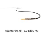 Studio audio or instrument cable extending and disappearing in to a white background. 1/4 inch phone connector.